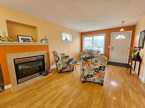 108-600 6 Street Street Sw, Slave Lake, AB - Indoor Photo Showing Living Room With Fireplace