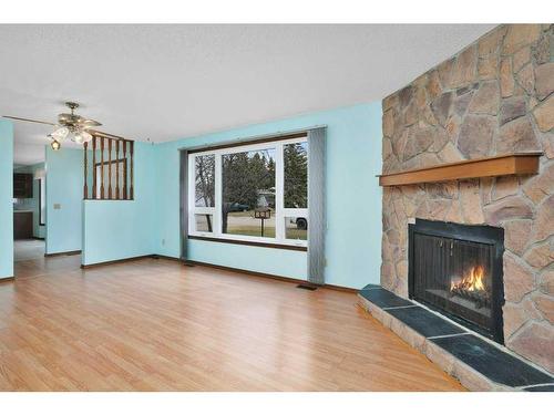 18 50 Avenue, Bluffton, AB - Indoor Photo Showing Living Room With Fireplace