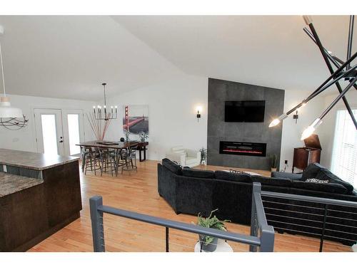 5217 39 Street, Ponoka, AB - Indoor Photo Showing Living Room With Fireplace