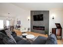 5217 39 Street, Ponoka, AB  - Indoor Photo Showing Living Room With Fireplace 