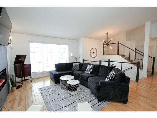 5217 39 Street, Ponoka, AB - Indoor Photo Showing Living Room With Fireplace