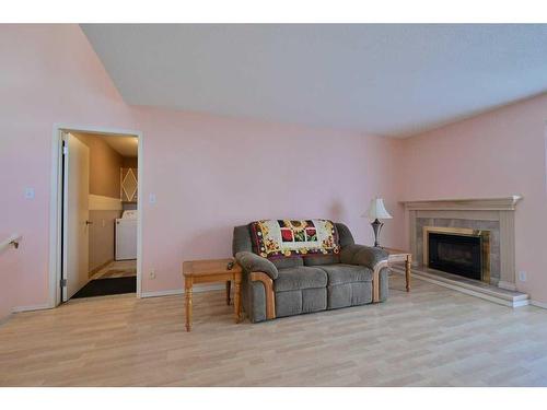 31 Escott Close, Red Deer, AB - Indoor Photo Showing Living Room With Fireplace