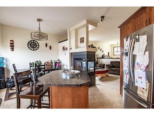 54 Mcdougall, Penhold, AB - Indoor With Fireplace