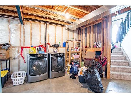 54 Mcdougall, Penhold, AB - Indoor Photo Showing Laundry Room