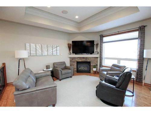 52 Oakdale Place, Red Deer, AB - Indoor Photo Showing Living Room With Fireplace