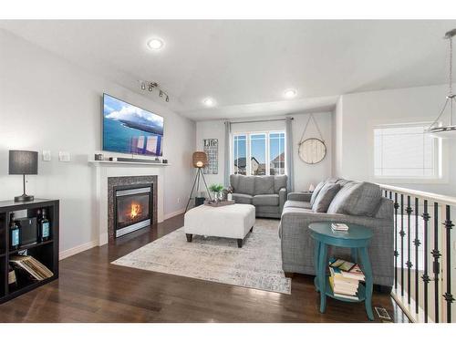 139 Isherwood Close, Red Deer, AB - Indoor Photo Showing Living Room With Fireplace