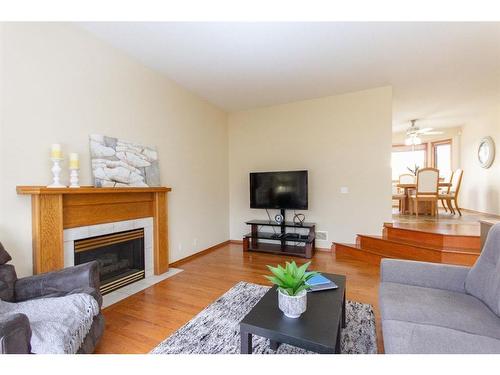 17 Kingston Drive, Red Deer, AB - Indoor Photo Showing Living Room With Fireplace