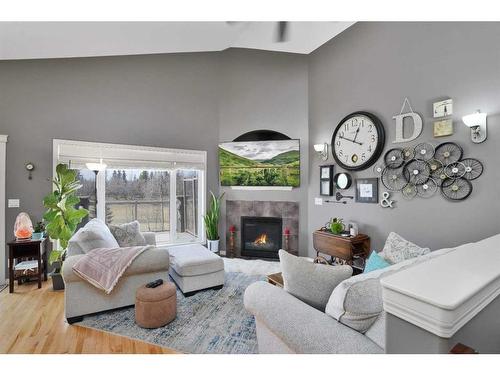 78 Oaklands Crescent, Red Deer, AB - Indoor Photo Showing Bedroom With Fireplace