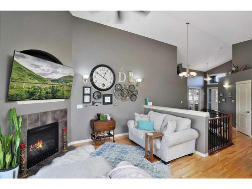 78 Oaklands Crescent, Red Deer, AB - Indoor Photo Showing Living Room With Fireplace