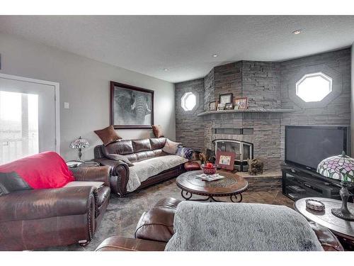 9 Macdonald Drive, Rural Stettler No. 6, County Of, AB - Indoor Photo Showing Living Room With Fireplace