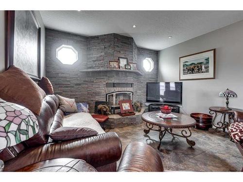9 Macdonald Drive, Rural Stettler No. 6, County Of, AB - Indoor Photo Showing Living Room With Fireplace