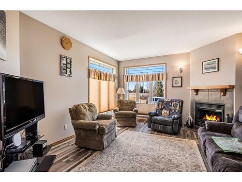 6 Elizabeth Park Boulevard, Lacombe, AB - Indoor Photo Showing Living Room With Fireplace