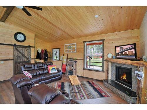 381055 Range Road 7-4, Rural Clearwater County, AB - Indoor Photo Showing Living Room With Fireplace
