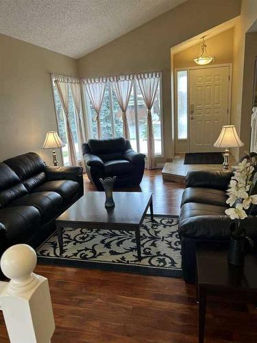 19 Sunhaven Way Se, Calgary, AB - Indoor Photo Showing Living Room With Fireplace