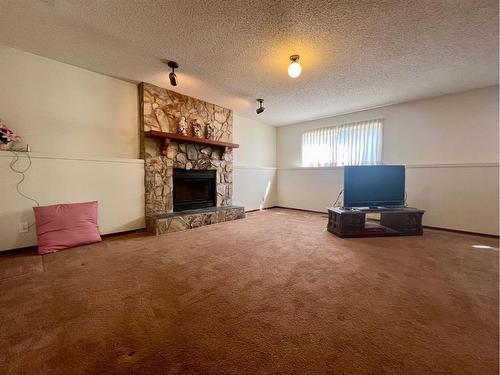 114 Rupert Crescent, Red Deer, AB - Indoor Photo Showing Living Room With Fireplace