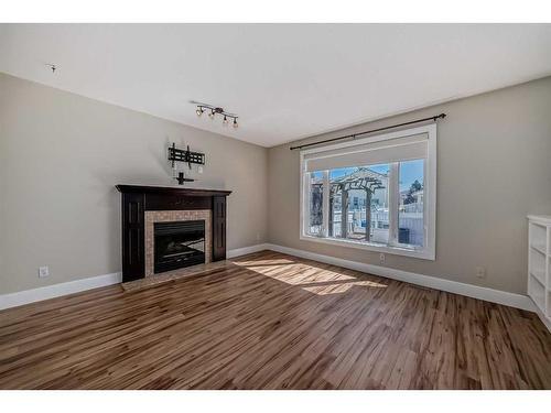 15 Armitage Close, Red Deer, AB - Indoor Photo Showing Living Room With Fireplace