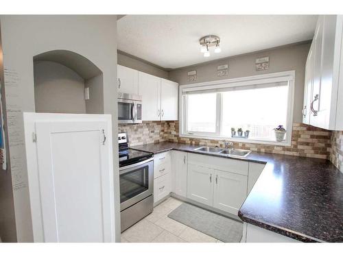 3417 41 Avenue, Red Deer, AB - Indoor Photo Showing Kitchen With Double Sink