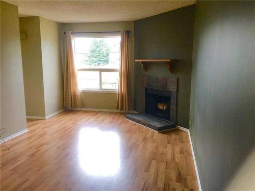 #58-31 Alford Avenue, Red Deer, AB - Indoor With Fireplace