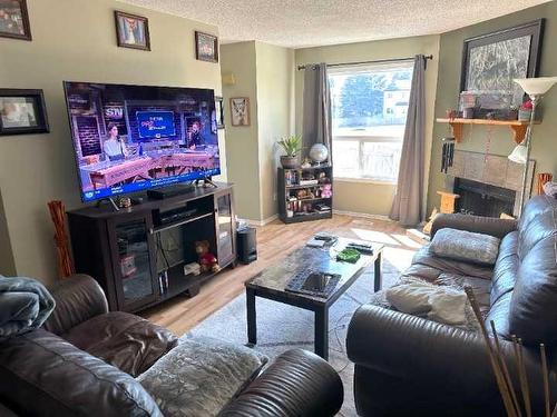 #58-31 Alford Avenue, Red Deer, AB - Indoor Photo Showing Living Room With Fireplace