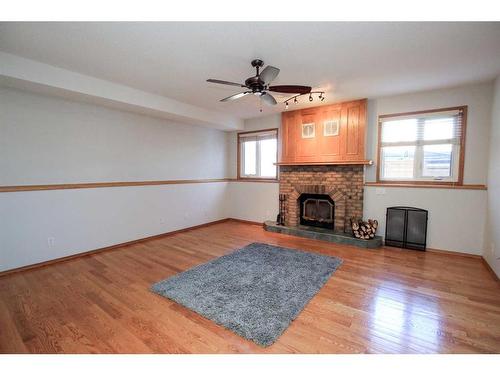169 Dixon Crescent, Red Deer, AB - Indoor Photo Showing Living Room With Fireplace