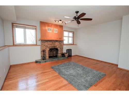 169 Dixon Crescent, Red Deer, AB - Indoor Photo Showing Living Room With Fireplace