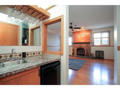 169 Dixon Crescent, Red Deer, AB - Indoor Photo Showing Kitchen With Fireplace
