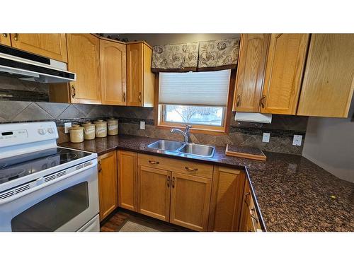 6010 58A Street, Rocky Mountain House, AB - Indoor Photo Showing Kitchen With Double Sink