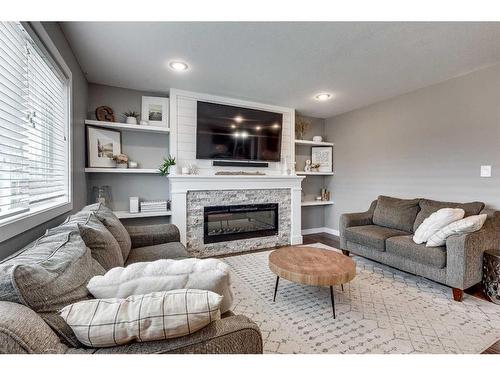 5719 45 Avenue Close, Rocky Mountain House, AB - Indoor Photo Showing Living Room With Fireplace
