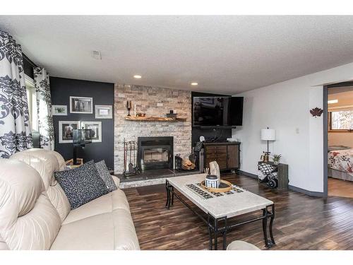 32 Drake Close, Red Deer, AB - Indoor Photo Showing Living Room With Fireplace