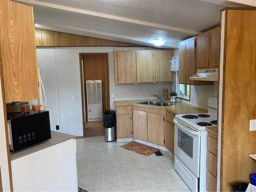 6402 51 Street, Ponoka, AB - Indoor Photo Showing Kitchen With Double Sink