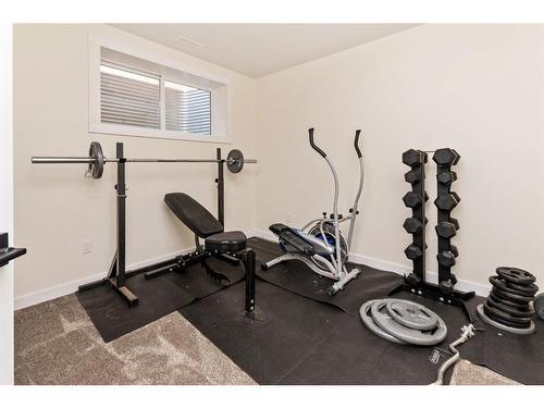 144 Hampton Crescent, Sylvan Lake, AB - Indoor Photo Showing Gym Room
