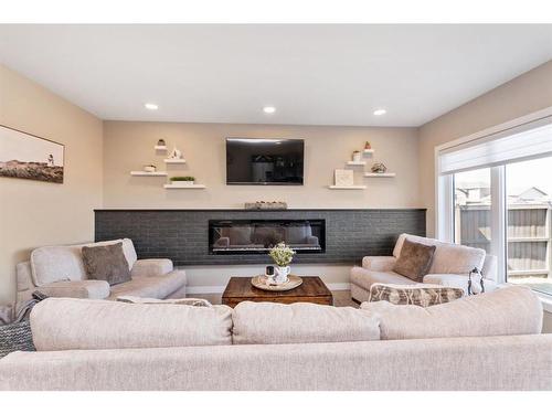 144 Hampton Crescent, Sylvan Lake, AB - Indoor Photo Showing Living Room With Fireplace