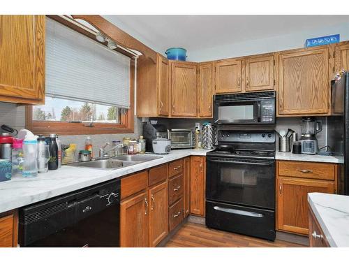 26 Dunlop Street, Red Deer, AB - Indoor Photo Showing Kitchen With Double Sink