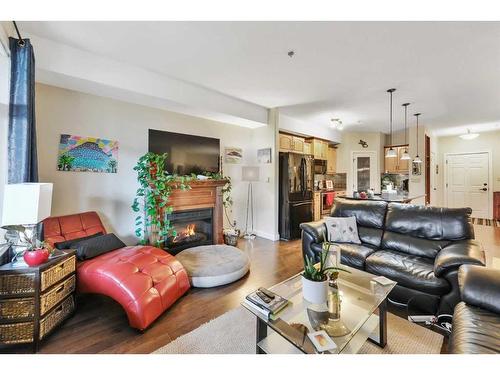 111-5213 61 Street, Red Deer, AB - Indoor Photo Showing Living Room With Fireplace