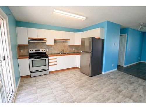 22-10 Fairbank Road, Red Deer, AB - Indoor Photo Showing Kitchen With Stainless Steel Kitchen With Double Sink