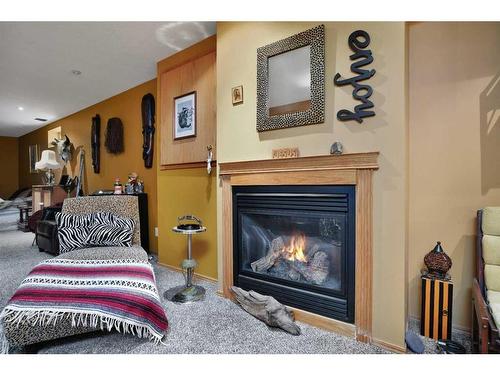 5 Wildrose Drive, Sylvan Lake, AB - Indoor Photo Showing Living Room With Fireplace