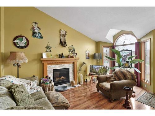5 Wildrose Drive, Sylvan Lake, AB - Indoor Photo Showing Living Room With Fireplace