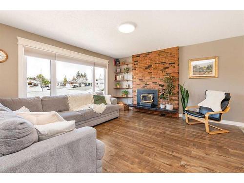 42 Patterson Crescent, Red Deer, AB - Indoor Photo Showing Living Room With Fireplace
