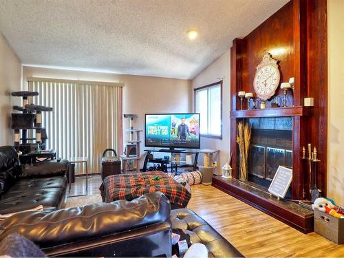 47 George Crescent, Red Deer, AB - Indoor Photo Showing Living Room With Fireplace