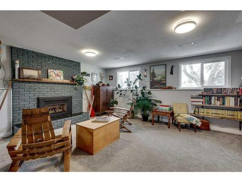59 Springfield Avenue, Red Deer, AB - Indoor Photo Showing Living Room With Fireplace