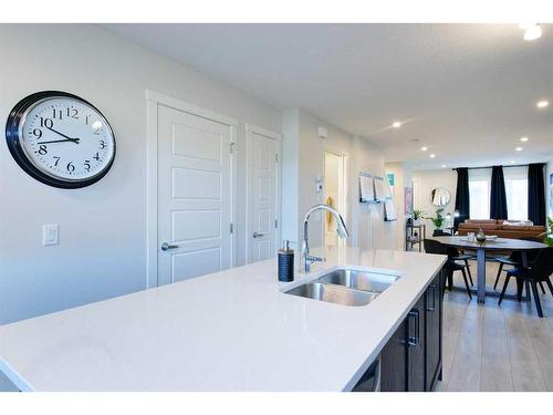 210-135 Mahogany Parade Se, Calgary, AB - Indoor Photo Showing Kitchen With Double Sink