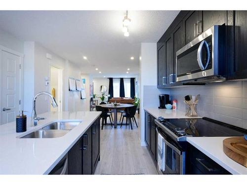 210-135 Mahogany Parade Se, Calgary, AB - Indoor Photo Showing Kitchen With Double Sink With Upgraded Kitchen