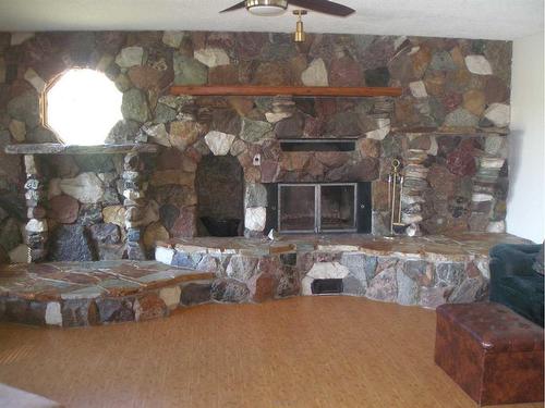 Twp Road 420 Road Ne, Rural Ponoka County, AB - Indoor Photo Showing Other Room With Fireplace