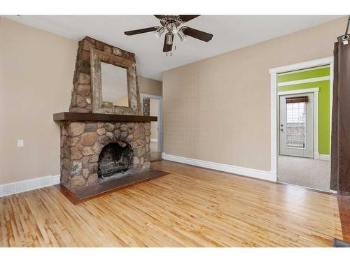 4938 49 Street, Sedgewick, AB - Indoor Photo Showing Living Room With Fireplace