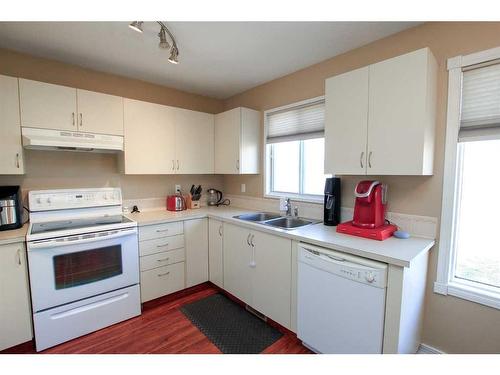 100 Good Crescent, Red Deer, AB - Indoor Photo Showing Kitchen With Double Sink