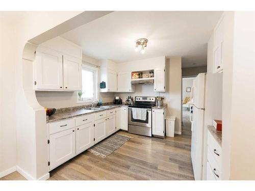 3705 50 Street, Red Deer, AB - Indoor Photo Showing Kitchen With Double Sink