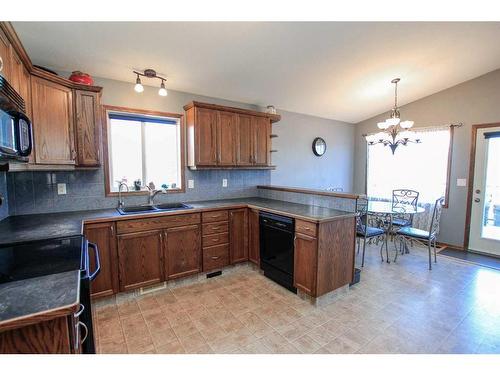 60 Isaacson Crescent, Red Deer, AB - Indoor Photo Showing Kitchen With Double Sink