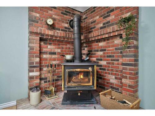 422045 Range Road 25, Rural Ponoka County, AB - Indoor With Fireplace