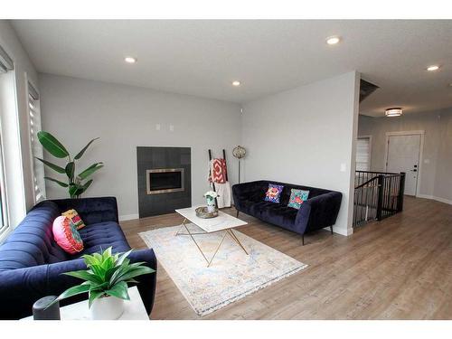 33 Larratt Close, Red Deer, AB - Indoor Photo Showing Living Room With Fireplace