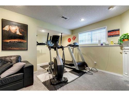 710 Hawkwood Boulevard Nw, Calgary, AB - Indoor Photo Showing Gym Room
